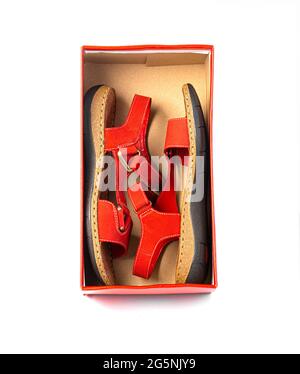 Red leather summer  sandal  in open box top view isolated on white Stock Photo