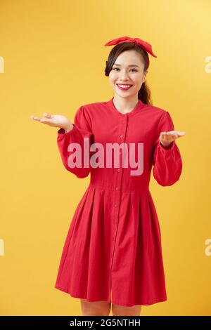 Beautiful woman doing different expressions in different sets of clothes: welcome Stock Photo