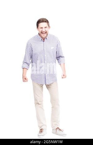 Vertical full length isolated shot of mature Caucasian man getting angry at something, white background Stock Photo