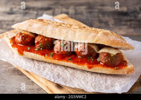 Meatball sub sandwich on wooden table Stock Photo