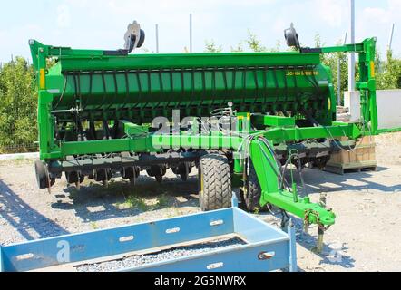 Kyiv, Ukraine - June 28, 2020: Large Corn harvester John Deere at road at Kyiv, Ukraine on June 28, 2020. Agricultural machinery at Ukraine. Stock Photo