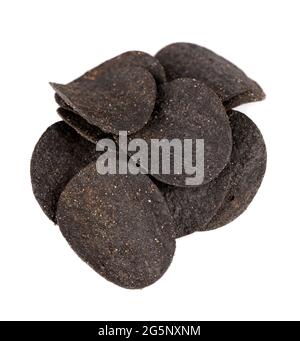 Black potato chips isolated on white background. Black chips with activated charcoal and red pepper. Stock Photo