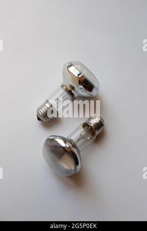Two silver incandescent light bulbs isolated on white background Stock Photo