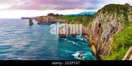 Scenic cliff landscape and sea in storm weather. Cliffs of hell in Spain,Asturias.Beautiful and dreamlike rocks in the ocean.