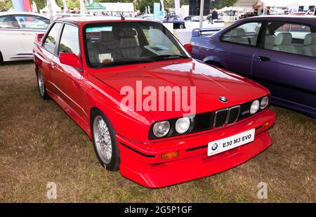 Three quarters Front View of a Missano Red, 1990, BMW E30 M3 Evo on display at the 2021 London Classic Car Show Stock Photo