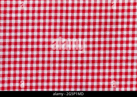 Red and white checkered fabric texture. Bright colored cotton background Stock Photo