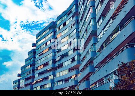 House building and city construction concept: evening outdoor urban view of modern real estate homes.Facade of building. Stock Photo