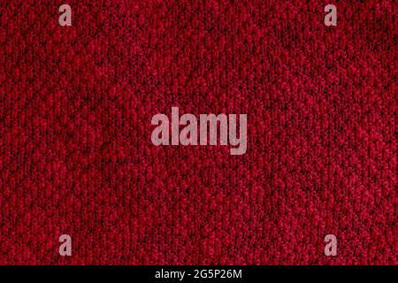 Dark red, burgundy knitted fabric texture. Rough sweater background Stock Photo