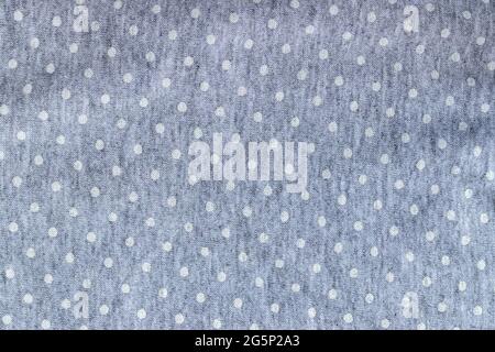 Soft gray cotton jersey fabric texture with white polka dot. Textile background Stock Photo