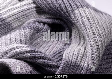 Gray two tone wool scarf background texture. Handmade product, closeup, selective focus Stock Photo