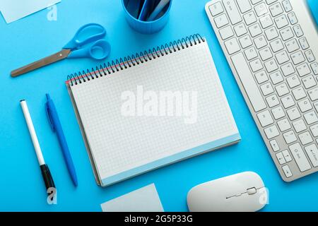 Office and school white blue stationery on pastel blue layout for work and education. back to school concept with mockup blank copy space. Blue desk Stock Photo