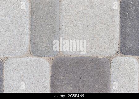 Outdoor concrete floor tiles background texture in different shades of gray Stock Photo