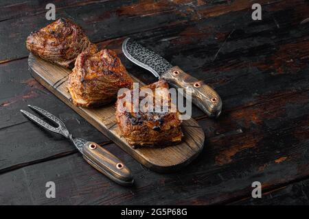 Homemade Braised Beef Short Ribs set, on old dark wooden table background, with copy space for text Stock Photo