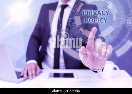 Text caption presenting Privacy Policy. Business approach Documentation regarding the management of the client s is data Bussiness Man Sitting Desk Stock Photo