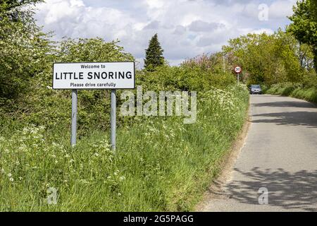 A road sign welcoming people to the village of Little Snoring, Norfolk UK Stock Photo