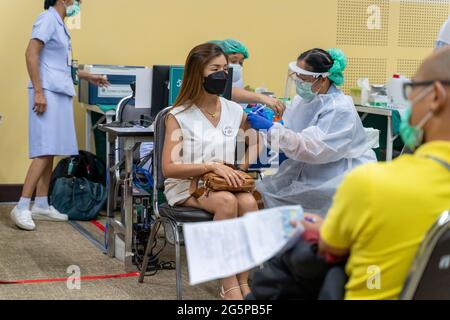 Chiang Mai, Thailand - 28 June 2021 - A Thai woman get her COVID-19 vaccine in Chiang Mai, Thailand Stock Photo