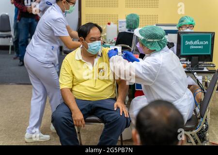 Chiang Mai, Thailand - 28 June 2021 - A Thai man get his COVID-19 vaccine in Chiang Mai, Thailand Stock Photo