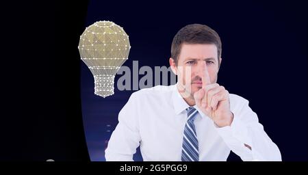 Composition of businessman touching interactive screen with lightbulb Stock Photo