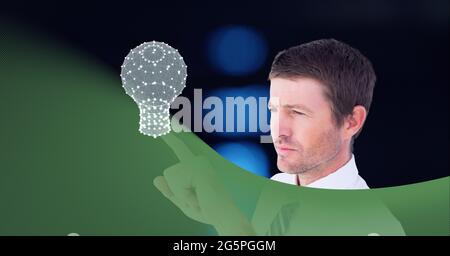 Composition of businessman touching interactive screen with lightbulb Stock Photo