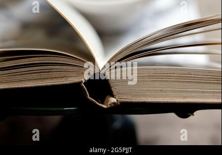 old book opened on lectern stand Stock Photo
