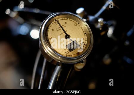 old vintage motorcycle speedometer on handlebars Stock Photo