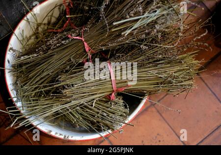 bowl of dried lavender on pantile floor in english country kitchen Stock Photo