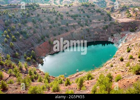 Toxic lake in open pit of abandoned Apliki copper mine, Cyprus Stock Photo