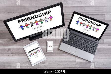 Friendship concept shown on different information technology devices Stock Photo