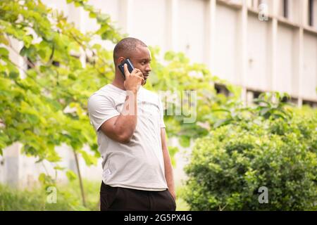 a young man talking on his phone Stock Photo