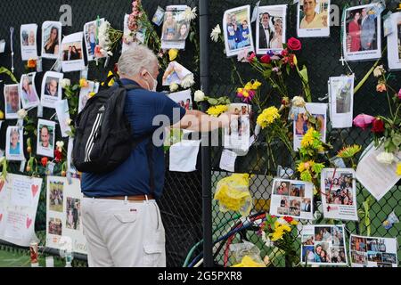 SURFSIDE FL - JUNE 28: People visit a make shift memorial, after the Champlain Towers south 8855 Collins Avenue which had collapsed, as family members remain missing after the collapsed condo building in Surfside on June 28, 2021 in Miami, Florida. :  Credit: mpi04 / MediaPunch Stock Photo