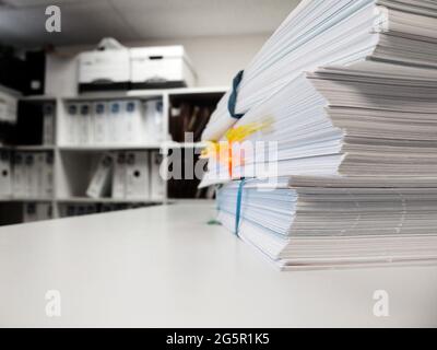 Pile of workfiles on desk in office business files Stock Photo
