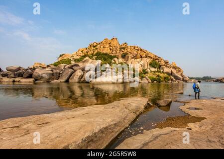 Big boulders and rocks along the Chakrairtha Lake in Hampi, Karnataka, South India - Asia Stock Photo