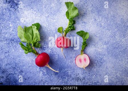 Radish on blue concrete backgrounds Stock Photo