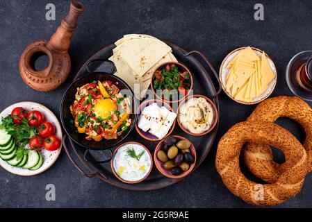 Traditional Turkish breakfast with meze and simit