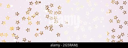 Banner with shiny gold colored stars confetti scattered on a white background. Stock Photo