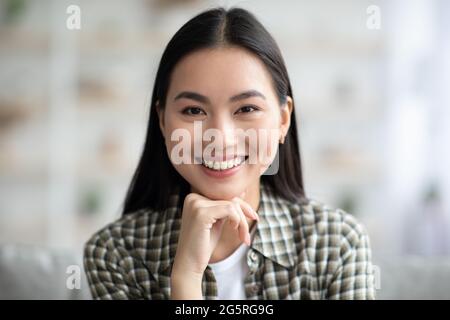 Potrait of attractive asian woman chilling at home Stock Photo