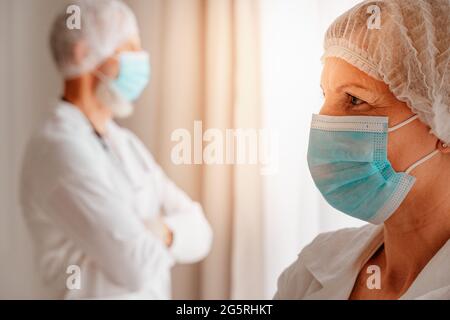 doctors with face mask think are ready to work Stock Photo