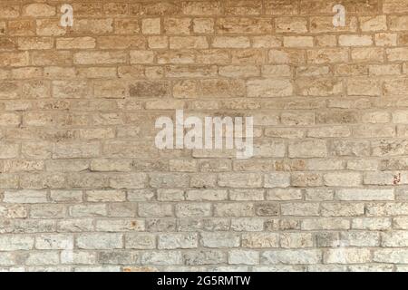 limestone natural briks wall. Cream and white brick wall texture background. Brickwork or stonework flooring interior rock old pattern stone design st Stock Photo