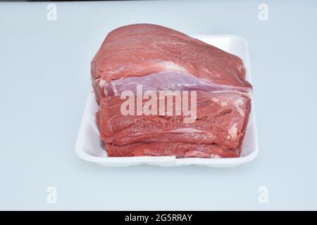 lamb thick flank boneless meat in plate on white background,butcher cut,raw mutton piece Stock Photo