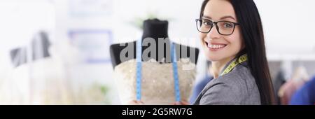 Portrait of young woman seamstress in wedding salon Stock Photo