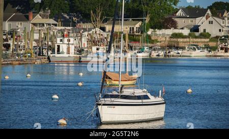 NORWALK, CT, USA - JUNE, 24, 2021: Evening lights on boats and view from Veterans Memorial Park and Marina Stock Photo