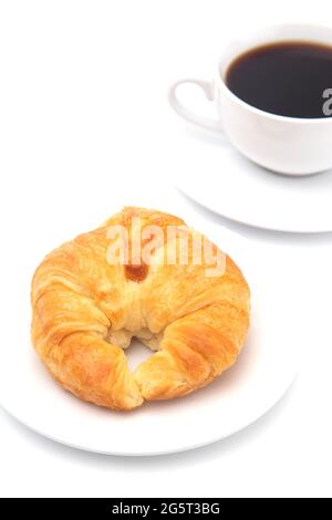 Freshly Baked Buttery French Croissants on a White Background with a Cup of Black Coffee Stock Photo