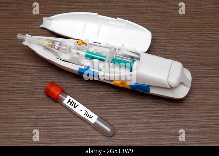 Sample blood collection tube with HIV test label on HIV infection ...