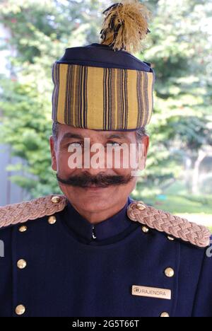 doorman in typical Indian work clothes , India, Agra Stock Photo
