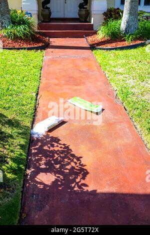 Hollywood, USA - May 6, 2018: Florida Broward County city in North Miami Beach area with entrance metal gate and background of luxury house mansion ne Stock Photo