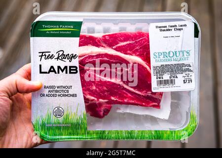 Herndon, USA - March 28, 2021: Free range red raw lamb meat shoulder chops by Thomas Foods raised without hormones in New Zealand packaged bought at S Stock Photo