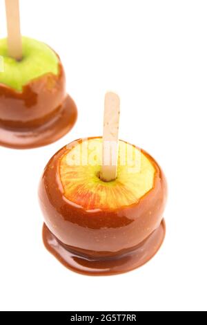 Hand Dipped Homemade Caramel Apples on a White Background Stock Photo