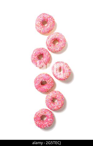 Pink yummy donuts on white. Top view.  Stock Photo