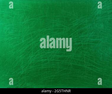 Old school chalkboard scratched in green. With traces of worn paint and chalk scratches. Gradient from edge to middle. Background. Stock Photo