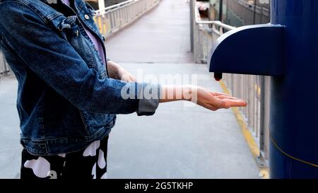 close up of woman's hand cleaning her hands with disinfectant. Disinfectant solution. Prevention epidemic. Protection from viruses Stock Photo